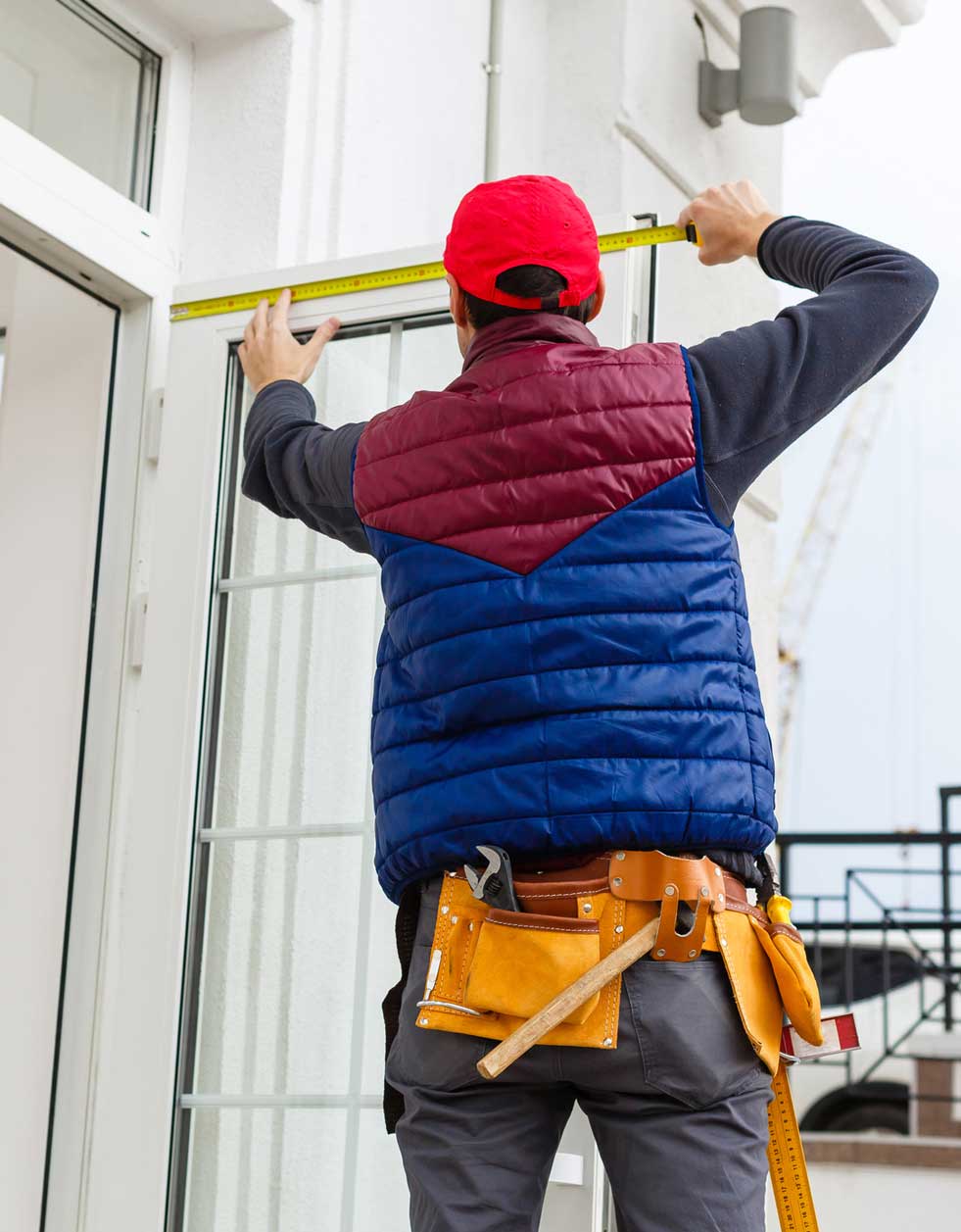 man measuring Door